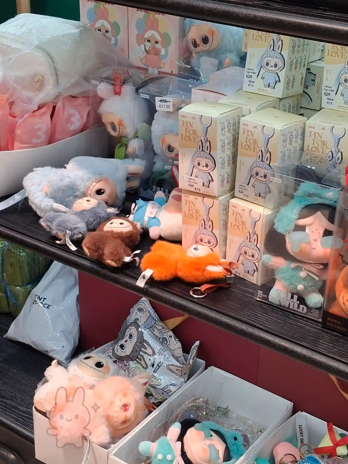 Shelf in Malta showing fake-looking Labubu figures and Labubu-style boxes.