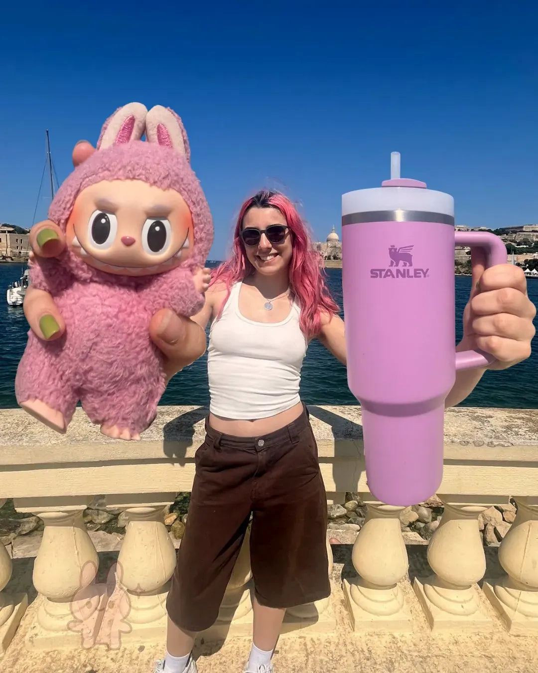 Mariana outdoors in Malta with her Lilac Stanley Quencher after two years of use
