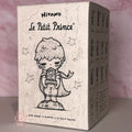 Hirono-Le-Petit-Prince Box featuring a stylized illustration of 'Le Petit Prince' with text and branding.