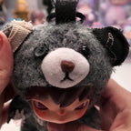 Hirono Road Journal Series Plush Doll Close-up of a plush toy with a gray face and black ears, held by hands.