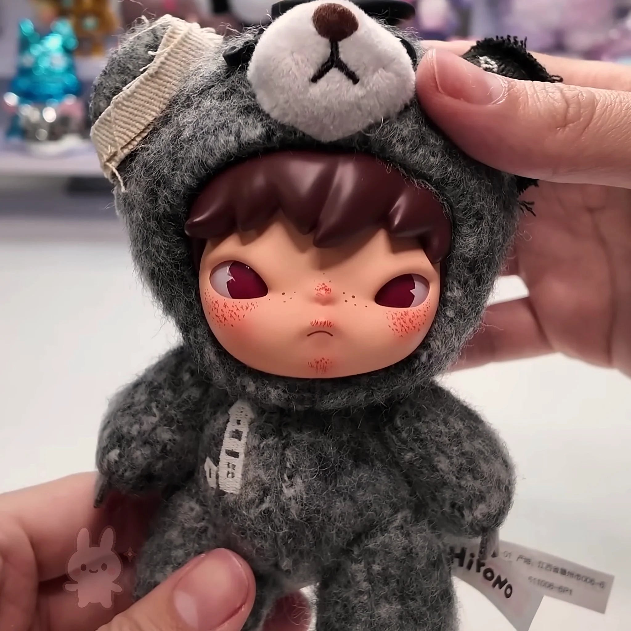 Hirono Road Journal Series Plush Doll Toy figure of a person in a bear costume held by hands