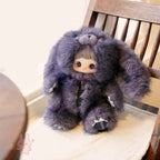 Maymei Rebel Doll Plush toy resembling a character with large ears on a wooden chair.