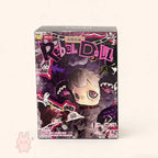 Maymei Rebel Doll Box of a 'Rebel Doll' with stylized character design on a white background