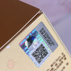 Molly Winter Fit Check Mini Bag Holographic scratch-off label with QR code on a product packaging