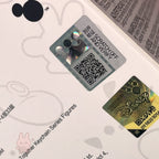 Scratch-off card with QR code and Disney logo on a white background