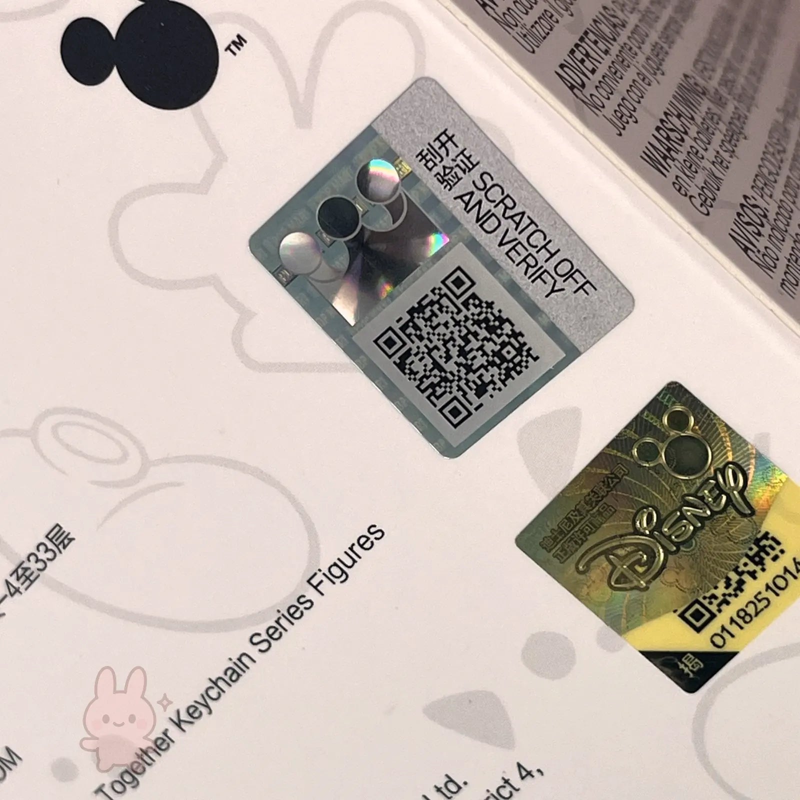 Scratch-off card with QR code and Disney logo on a white background