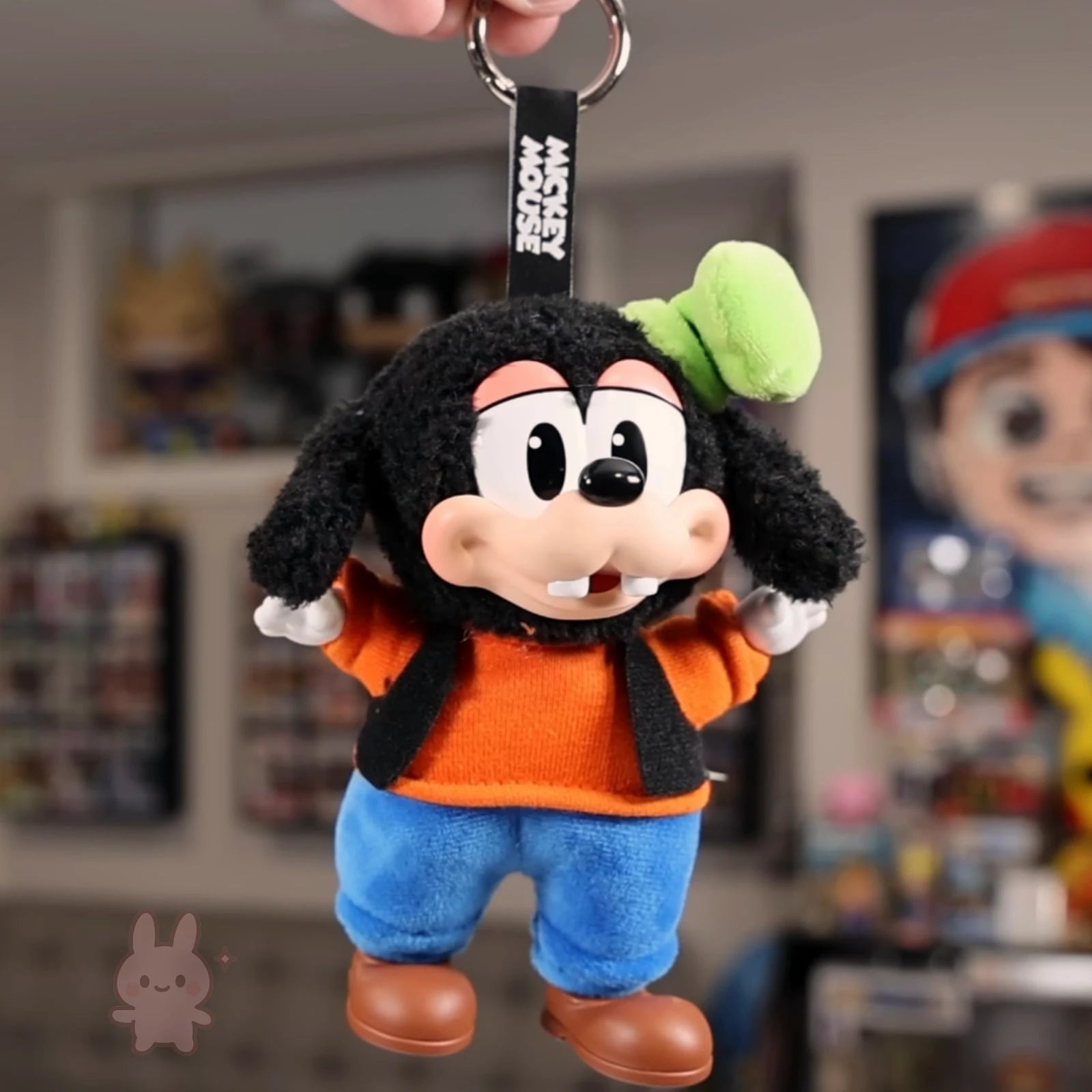 Plush keychain of a cartoon character with a blurred background