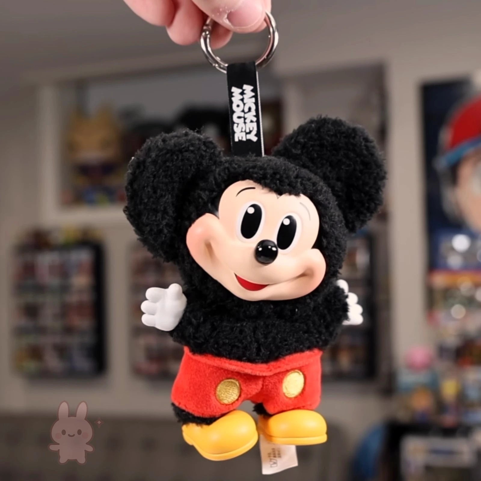 Plush keychain of a cartoon character with a blurred background