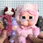 Pop-Mart-Have-a-good-run Pink plush toy with a small card featuring another character in the background