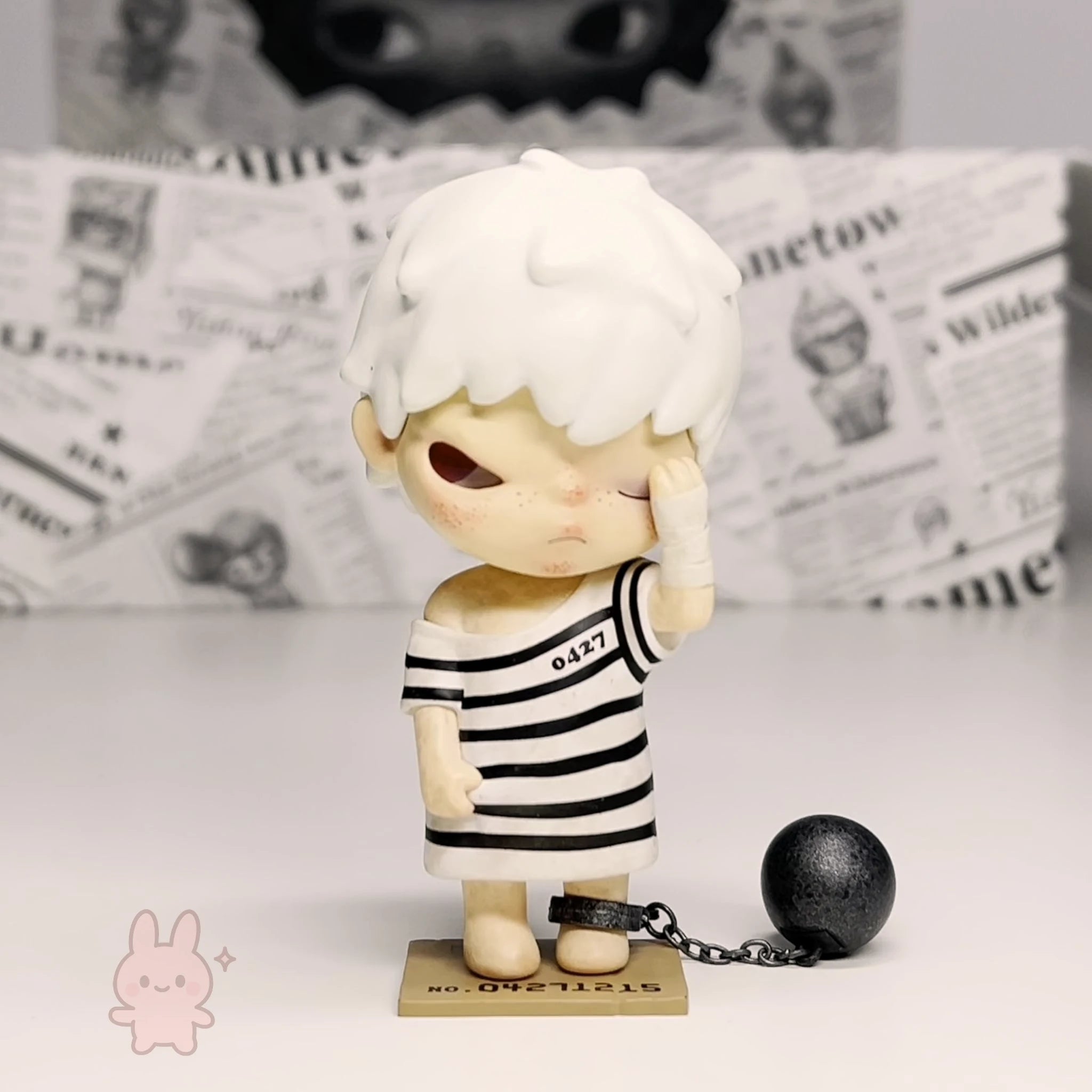 Pop Mart Hirono Little Mischief Figurine with white hair and striped outfit on a light background
