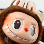 Pop Mart Labubu Halloween Close-up of a plush toy with a cartoonish face and brown fur.