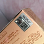Pop Mart PUCKY Tap Tap Babies Close-up of a product packaging with a QR code label on a blurred background