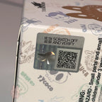 Pop Mart The Monsters 10th-anniversary Product packaging with a scratch-off and verify label and QR code on a Tycoco branded box.