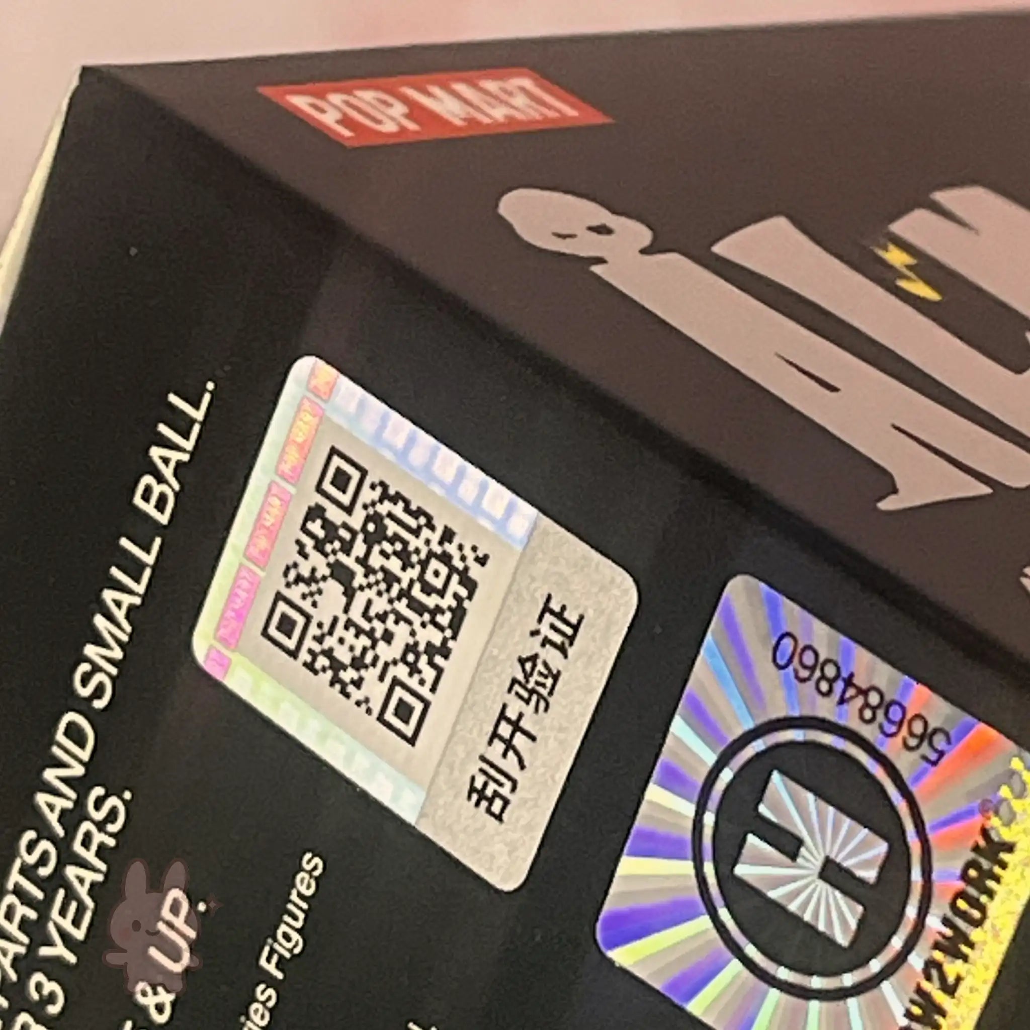 Pop Mart The Monsters Almost Hidden Product packaging with QR code and holographic label, featuring the Pop Mart brand.