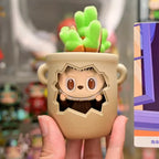 Pop Mart The Monsters Almost Hidden Cute animal-shaped planter held by a hand with a blurred store background