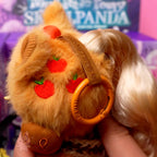 SKULLPANDA My Little Pony Plush Close-up of a plush toy with a headband featuring red apples, held against a blurred background.