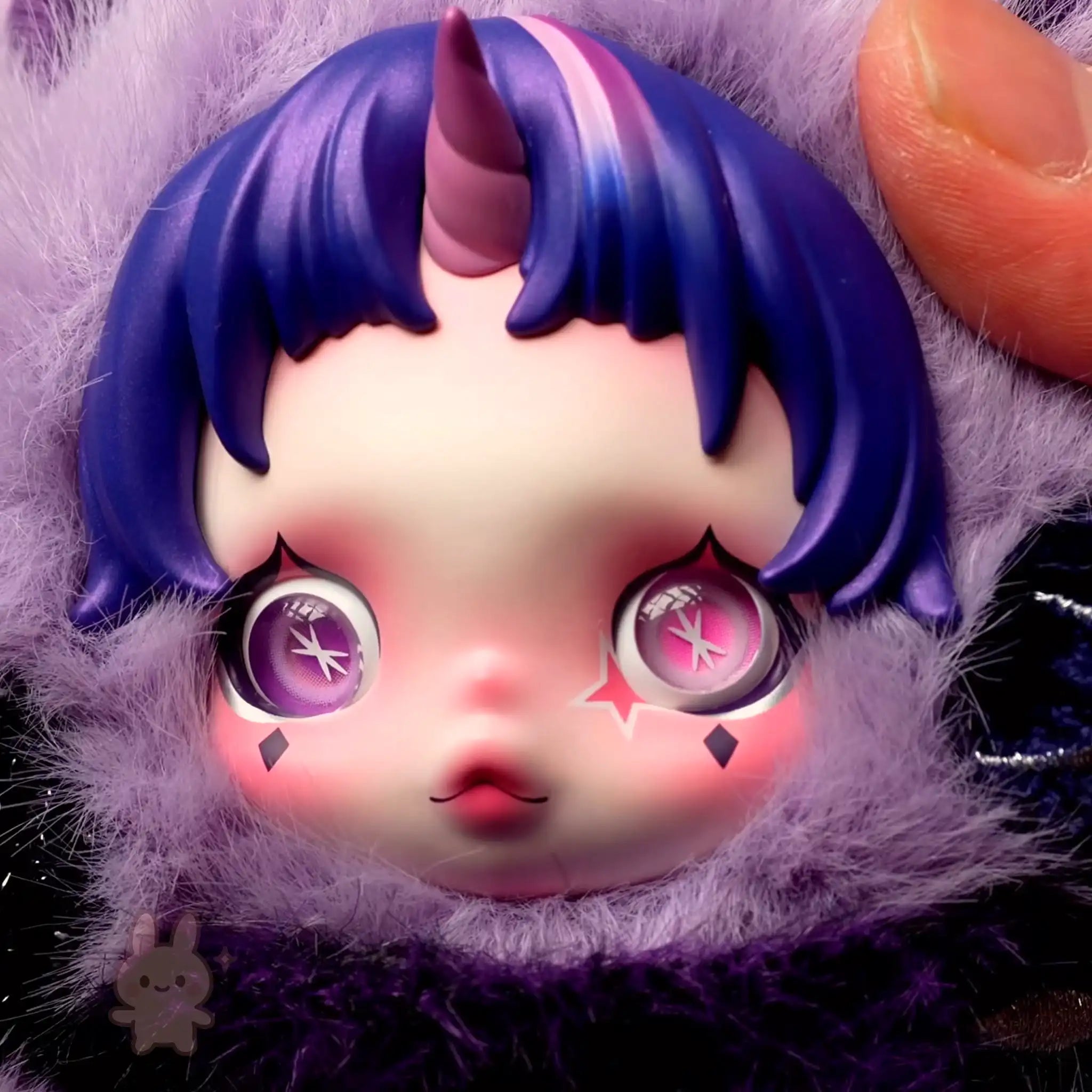 SKULLPANDA My Little Pony Plush Small figurine with purple hair and large eyes on a fluffy white surface