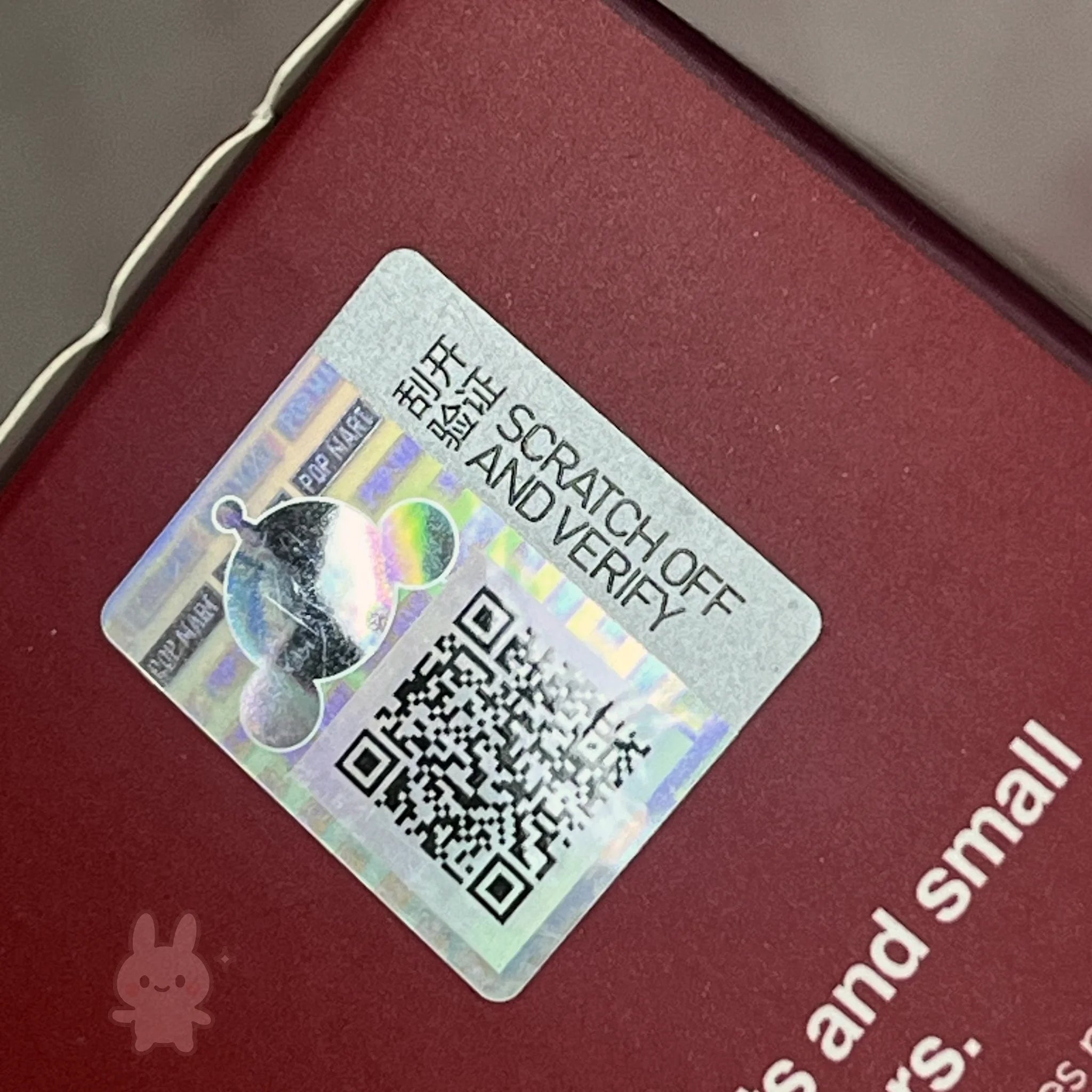 Skullpanda-the-feast-begins Scratch-off security label with QR code on a red surface
