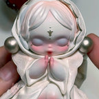 Skullpanda-the-feast-begins Detailed figurine held by a hand with a soft focus background