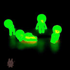 Smiski Glowing green figures on a black background