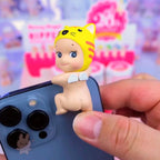 Sunny Angel Hippers Phone case with a cat-themed baby figurine on a blurred background