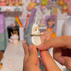 Sonny Angel Mofusand Hippers Person holding a small figurine with a colorful background