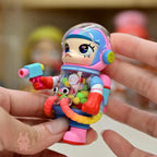 Space molly 100 series4 Colorful toy figure held in hands with a blurred background