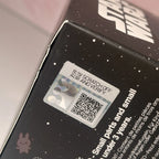 Star Wars Grogu Tiny But Mighty Product packaging with a scratch-off label and QR code on a black surface.