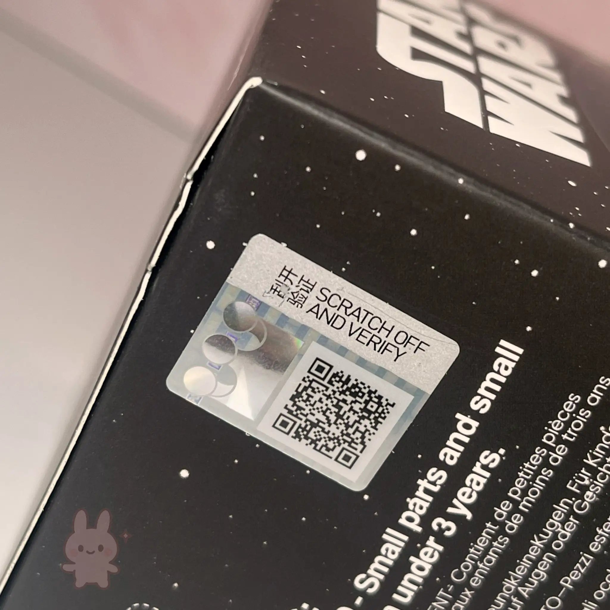 Star Wars Grogu Tiny But Mighty Product packaging with a scratch-off label and QR code on a black surface.