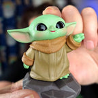Star Wars Grogu Tiny But Mighty Toy figure of a character from a popular franchise held by a hand.