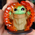 Star Wars Grogu Tiny But Mighty Toy figure of a character with orange hair and green face held by hands.