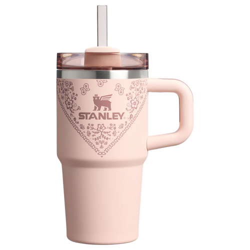 Pink Stanley mug with floral design on a white background