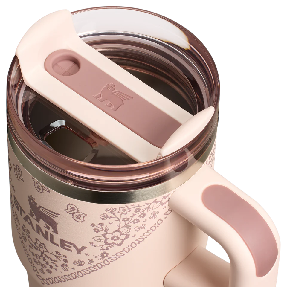 Pink Stanley mug with floral pattern on a white background