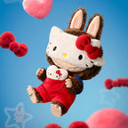 The monsters hello kitty large plush toy resembling a cat with a red bow on a blue background