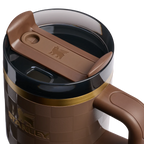 Brown travel mug with a brown lid on a white background