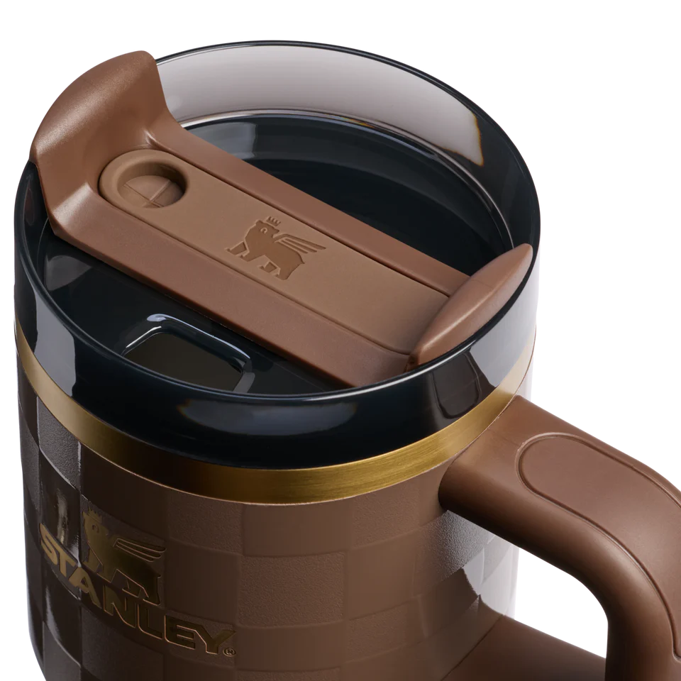 Brown travel mug with a brown lid on a white background