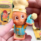 Twinkle Twinkle Be a Little Star Toy figure of a character with a chef's hat and apron, held by a hand.