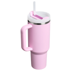 Pink Stanley tumbler with a handle and straw on a white background