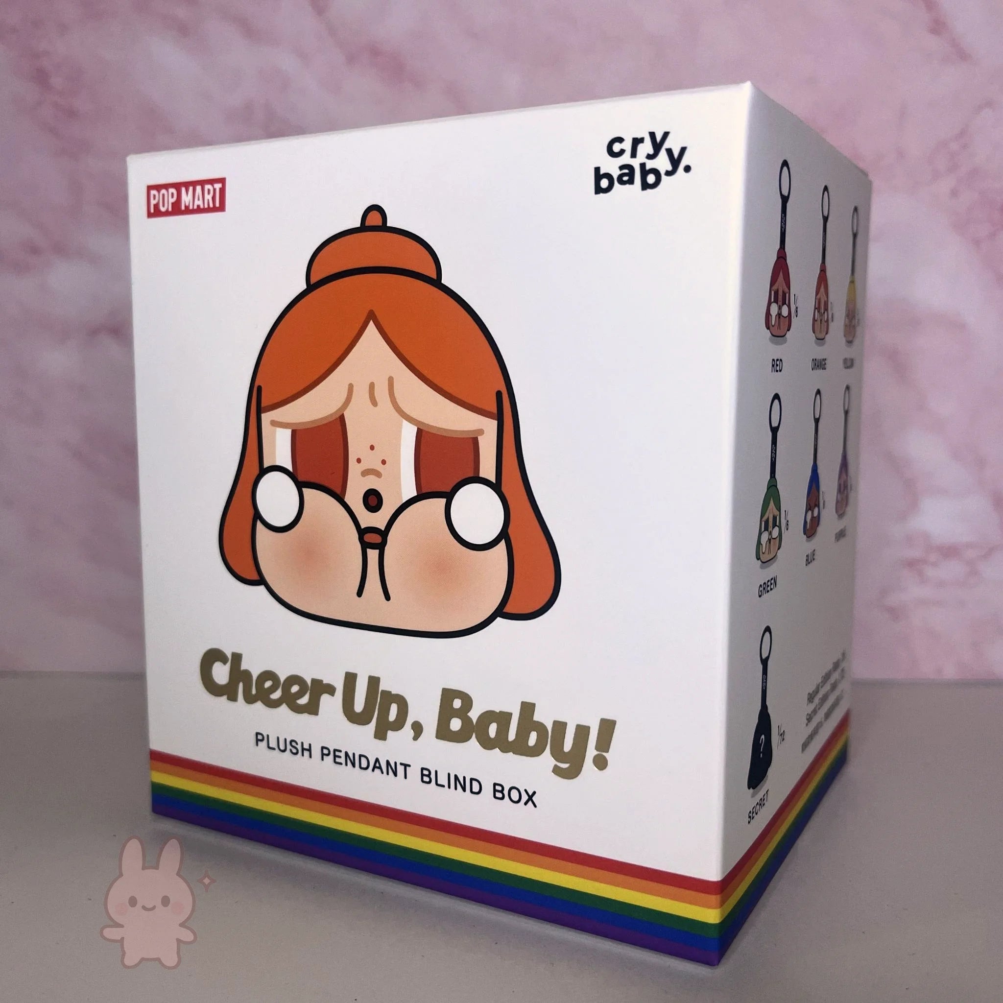 Box packaging for 'Cheer Up, Baby!' plush pendant blind box by Pop Mart on a pink background.