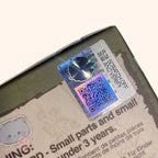 dimoo-the-missing-day Product with a scratch-off security label and QR code on a white background