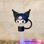 Cartoon character straw lid with black hair and pink skull on a blurred background