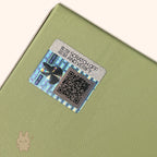Labubu – Exciting Macaron Vinyl Face – security label with QR code on a green surface