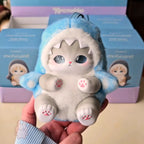 mofusand fluffy kittens Cute cat-shaped plush toy held in front of a blue and purple box with 'mofusand' branding.