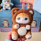 mofusand fluffy kittens Cute animal-shaped phone case held by a person with a blurred background