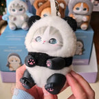 mofusand fluffy kittens Plush panda keychain held by a hand with 'molu sand' packaging in the background.