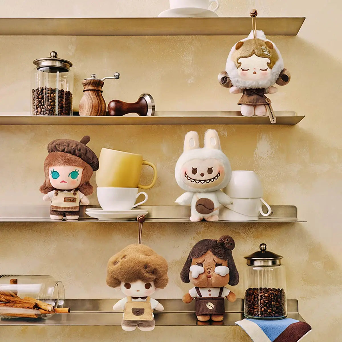 Coffee Factory plush pendants displayed on café shelves