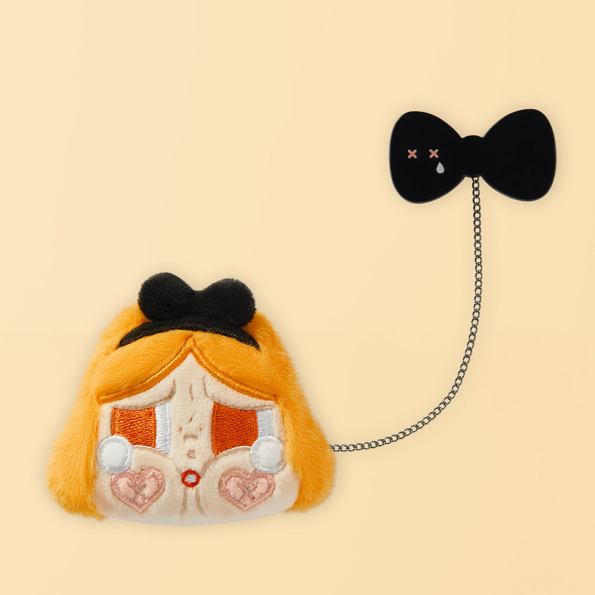 Orange-haired CRYBABY plush badge with black bow charm