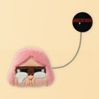 Pink-haired CRYBABY plush badge with black disc charm