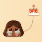 Brown-haired CRYBABY plush badge with cake charm