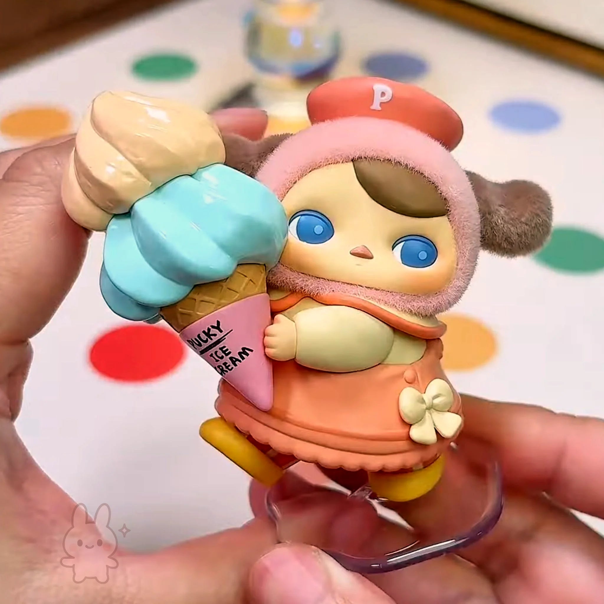 pucky faries market Toy figure of a character holding an ice cream cone with colorful details